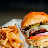 Classic Cheese Burger · Lettuce, pickle, onion, tomato, and aged white  cheese.