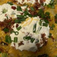 Plain Baked Potato · Includes cheese, sour cream, butter, chives, bacon bits.