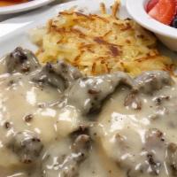 Biscuits & Gravy · Buttermilk biscuits, crumbled sausage with gravy and two eggs.