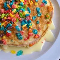 Fruity Pebbles Pancakes · Comes with three fruity pebble sweet cream pancakes, and vanilla sauce.