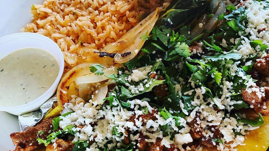 #21 Selina'S Street Tacos · 4 mini street tacos, your choice of beef or chicken fajita, barbacoa, or pastor, topped with grilled onions, cilantro, queso fresco. Served with rice and charro beans.
