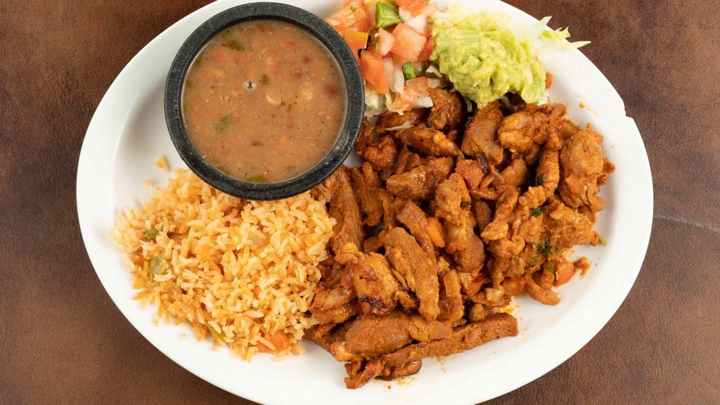 #25 El Pastor Plate · Grilled marinated pork, served with rice and beans and guacamole salad.