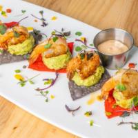 Guaca Camarón · Grilled chile-lime shrimp on top fresh smashed guacamole. May be served raw or undercooked; ...