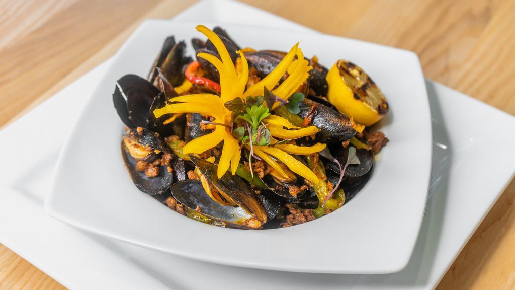 Mejillones Con Chorizo · Steamed mussels topped with Mexican chorizo and cilantro. May be served raw or undercooked; consuming raw or undercooked meats, poultry, seafood, shellfish, or eggs may increase your risk of food borne illness, especially if you have certain medical conditions.