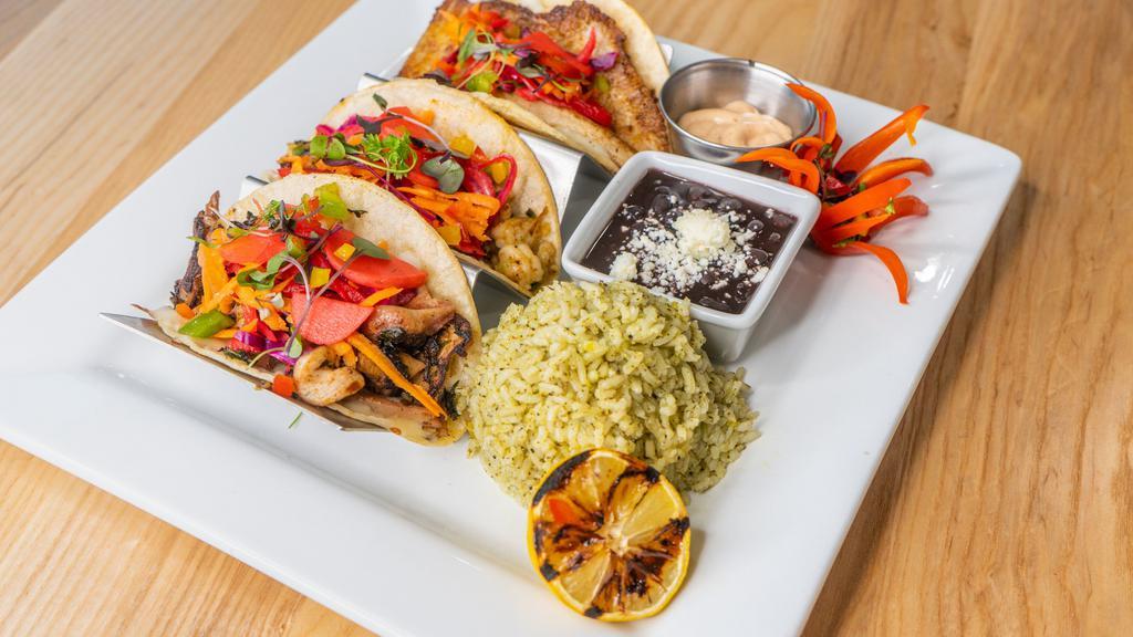 Tacos Tri Mariscos · Grilled octopus, shrimp, and fish tacos. May be served raw or undercooked; consuming raw or undercooked meats, poultry, seafood, shellfish, or eggs may increase your risk of food borne illness, especially if you have certain medical conditions.