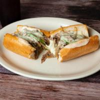 Philadelphia Cheesesteak · Thinly sliced steak, with onions and green peppers and topped with  melted mozzarella.