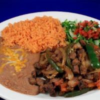 Bistec Ranchero · Chopped top sirloin prepared with onions, tomatoes & jalapeños in ranchero sauce. served wit...