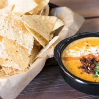 Hillbilly Queso & Chips · Homemade chips & green chile queso upgraded with Texas chorizo. Contains: Avocado