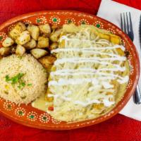 Enchiladas Suizas · 3 pieces. Corn Tortilla in Swiss-Style Green Sauce with Chicken, Cheese Cream Served with Ri...