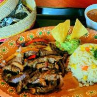 Fajitas De Res · Beef & Chicken Fajita, Roasted Onions & Peppers. Choose Served with Guacamole, Rice, and Cha...