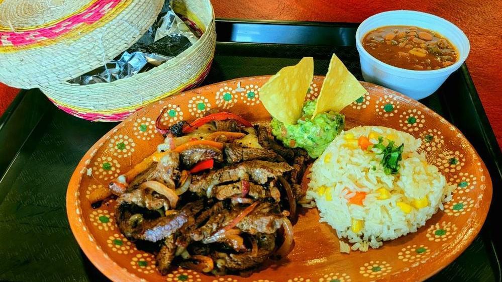 Fajitas De Res · Beef & Chicken Fajita, Roasted Onions & Peppers. Choose Served with Guacamole, Rice, and Charro Beans.