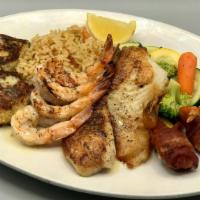 Fish Market Platter · Two Crab Cakes, Fish Fillet, 2 Shrimp Kisses, Broiled Skewer of Shrimp, Vegetables, & Rice P...