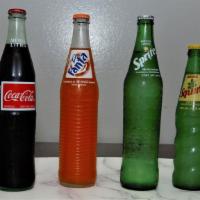Mexican Sodas · Topo Chico, Coca Cola, Fanta, Sprite, Squirt, Sangria