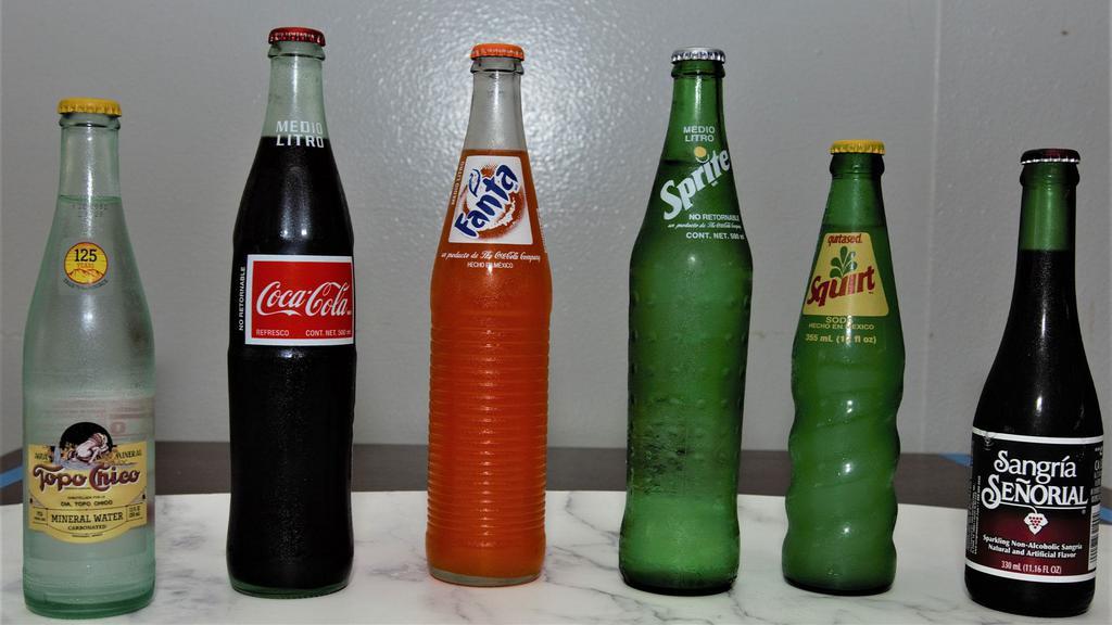 Mexican Sodas · Topo Chico, Coca Cola, Fanta, Sprite, Squirt, Sangria