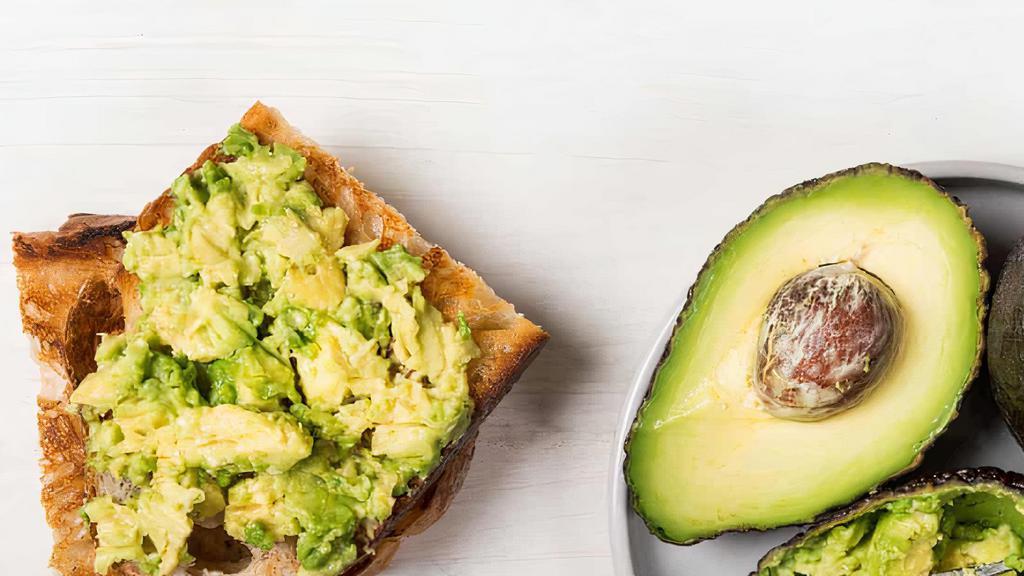 Avocado Toast · 1 slice of our signature wheat berry  bread toasted and topped with avocado, goat cheese and side of honey lime sauce to drizzle.