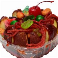 Manzana Preparada · Apple covered in chamoy paste and chile Miguelito with liquid chamoy, salsagheti, assorted g...