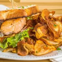 Salmon Sammie · Market Bread served with seared fillet of salmon, lettuce, tomato and purple onion. *Turn it...