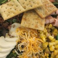 Fiesta Cobb Salad · A palate of color. turkey, tomatoes, cheese, corn, eggs, bacon, avocado & sunflower seeds ar...