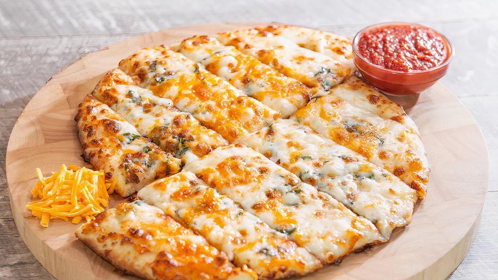 Knickerbocker Cheesy Bread · Our famous pizza dough (made fresh daily), topped with hand grated mozzarella, cheddar cheese, garlic and fresh basil, served with homemade marinara.