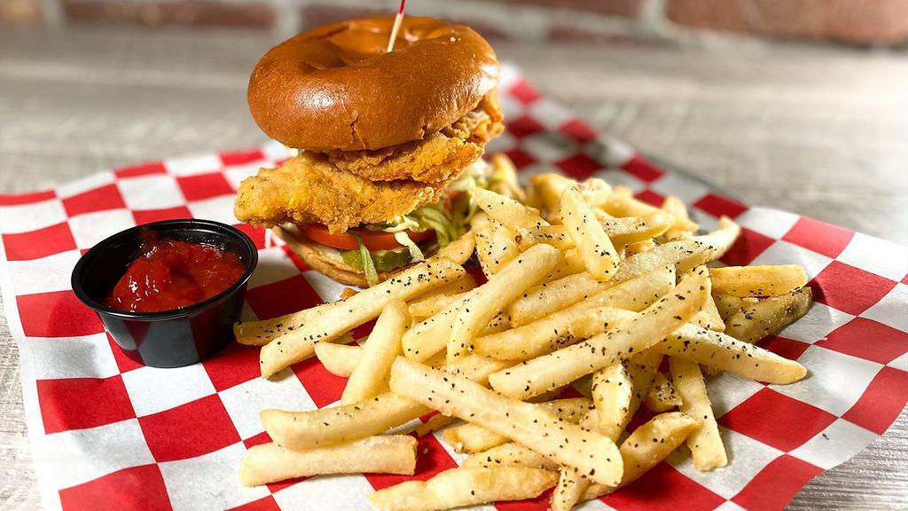 The Fried Chicken Sandwich · Fresh, never frozen, hand-battered chicken, lettuce, tomato, pickles and mayonnaise – Get it Buffalo-style by adding Buffalo sauce to your chicken. Add melted American cheese, hand-grated mozzarella or blue cheese for an additional charge.