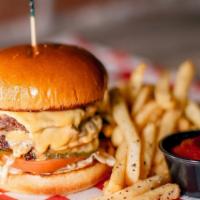 The Burger · Two 1/4 pound patties, topped with lettuce, tomatoes, pickles, melted American cheese, and P...