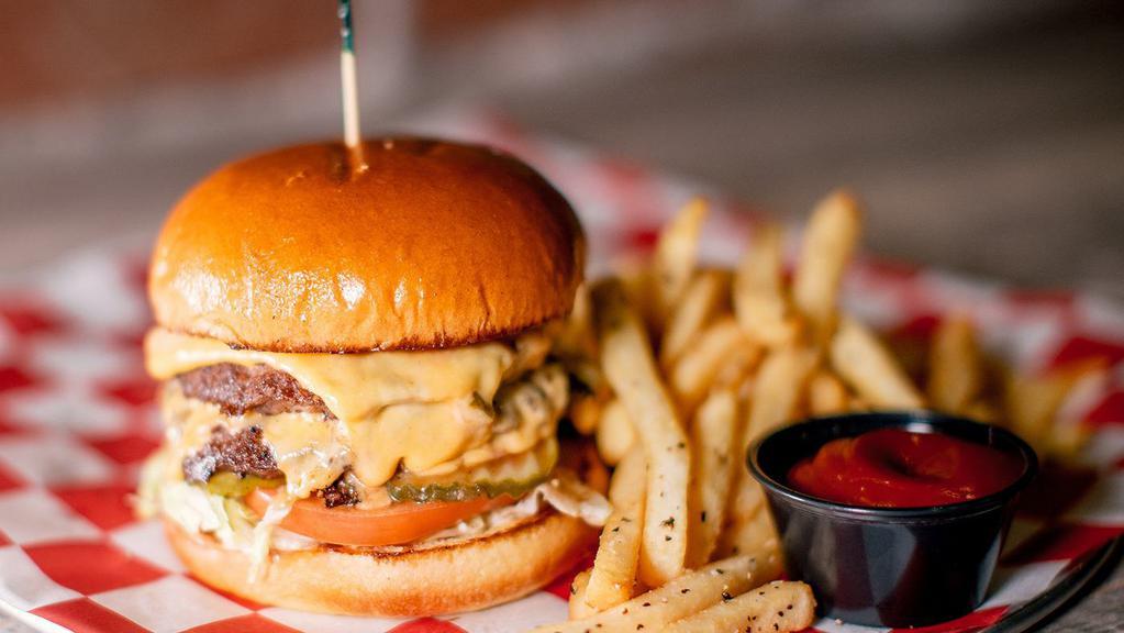 The Burger · Two 1/4 pound patties, topped with lettuce, tomatoes, pickles, melted American cheese, and Parry’s burger sauce – Served with fries. Upgrade to Parmesan Fries for an additional price. Add bacon to your burger for an additional price.
All burgers are cooked medium-well (at least 155˚)