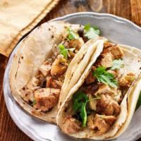 Chicken Chipotle Signature Taco · Shredded chicken breast cooked in chipotle peppers and onions. Served with lettuce, jack che...