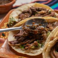 Barbacoa Taco (1 Pc) · Braised barbacoa meat on your choice of corn or flour tortilla topped with onions and fresh ...