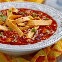 Chicken Tortilla Soup · A hearty soup with rich broth, pieces of chicken and tortilla chips.