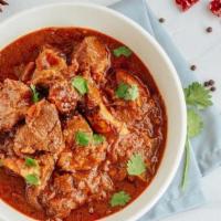 Goat Curry. · stewed bone-in goat . garam masala .