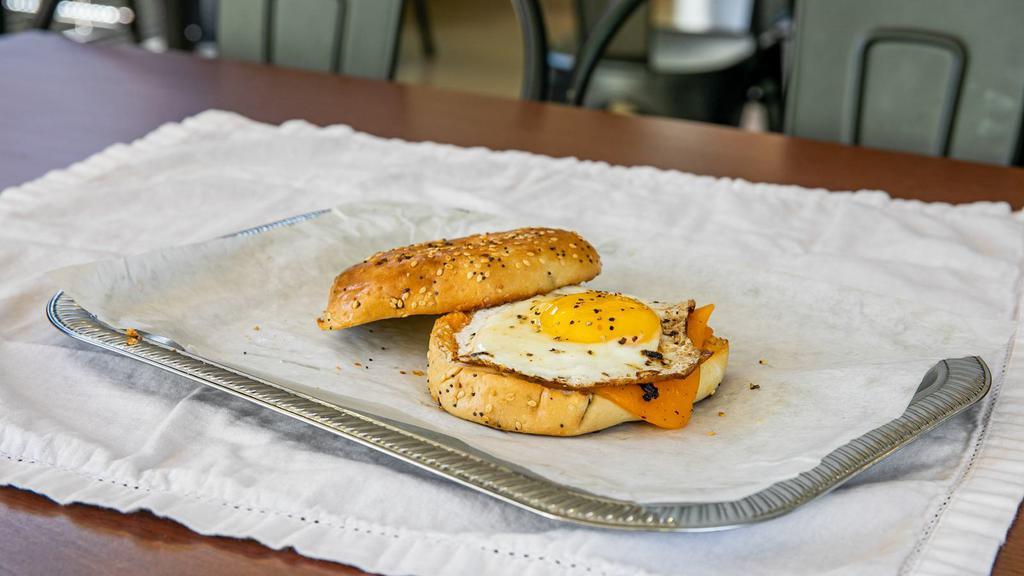 Bagel Trio · Egg, cheddar and choice of ham or bacon on bagel.