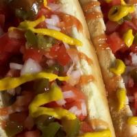 Perro Caliente (Mexican Hot Dogs) (2) · 2 Mexican hot dogs served with bacon, tomato, onions, pickles and a side of French fries.