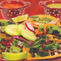 Corn Tortilla Tacos (5) · Corn tortilla tacos served with onions, cilantro, red salsa, green salsa, cucumbers, limes, ...