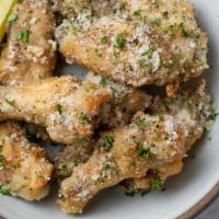 Fried Garlic Wings · Cooked wings of a chicken coated in sauce or seasoning.