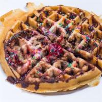 Chocolate Chip Waffle · Topped with powdered sugar,chocolate sauce,whipped cream& cherry