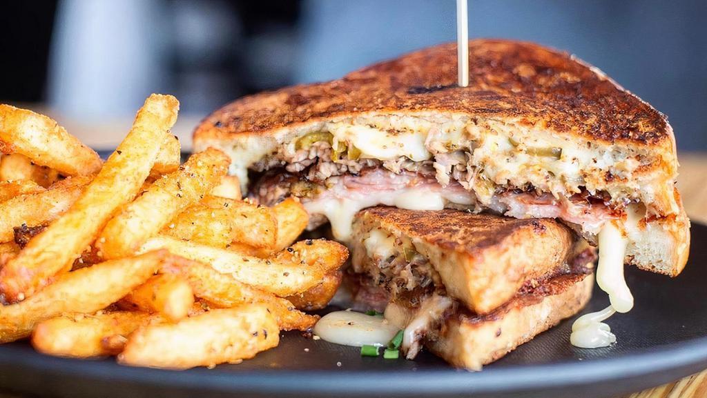 Cubano Grilled Cheese · Mojo Roasted Berkshire Pork, Pecan Smoked Ham
Swiss, Provolone, Pickled Jalapeños, Creole Mustard
Sourdough Bread. Served with French Fries.