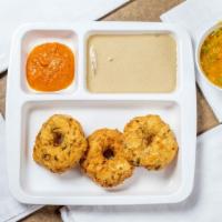 Vada · Three lentil donuts served with sambar and chutney.