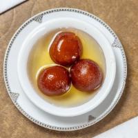 Gulab Jamun (With Ice Cream) · Deep fried milk dumpling soaked in cardamom flavored sugar syrup with Ice cream