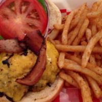 Double Cheeseburger Combo · Two 1/3 pound patties covered with Cheddar cheese. Served with lettuce, tomato, onion, and p...