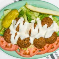 Falafel Salad · Lettuce, tomatoes, cucumbers, onions, black olives and Feta cheese. Choice of dressing.