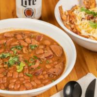 Beans & Rice · Slow-cooked with seasoned ground beef and sausage.