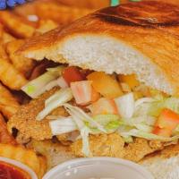 Fried Fish Sandwich · Fried catfish fillet, lettuce, tomato, pickle, American cheese and tartar sauce on grilled t...