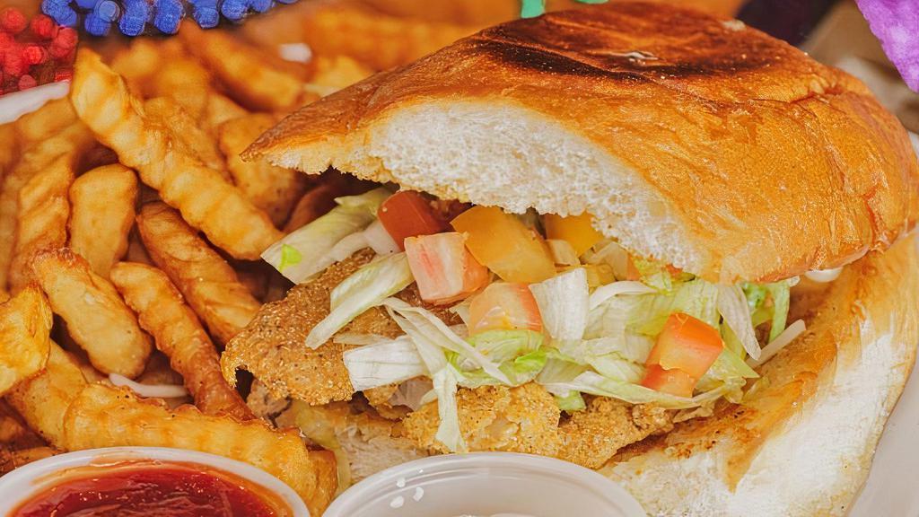 Fried Fish Sandwich · Fried catfish fillet, lettuce, tomato, pickle, American cheese and tartar sauce on grilled torta bread.