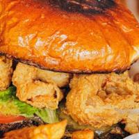 Surf & Turf Burger · Blackened beef patty, topped with onion rings, fried shrimp, lettuce, tomato, pickle, Jack c...
