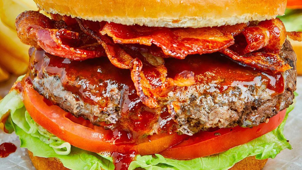 The Bbq Hamburger · Angus beef, cheddar, bacon, lettuce, tomato and BBQ sauce on a brioche bun.