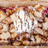 S'Mores Funnel Cake Fries · Our Funnel Cake Fries, covered in cinnamon sugar, whipped cream, topped with teddy grahams, ...