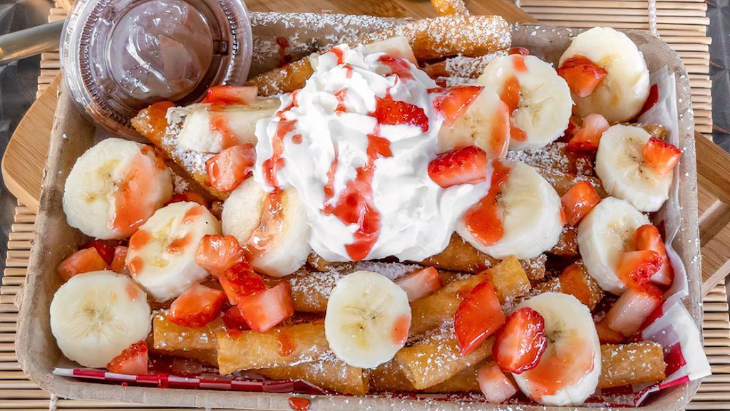 Strawberry Banana Nutella Funnel Cake Fries · Fresh bananas, fresh strawberries, real strawberry puree, Nutella, powdered sugar, and whipped cream.