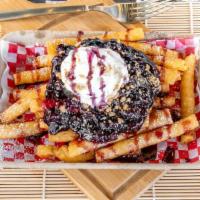 Blueberry Pie Funnel Cake Fries · Blueberry pie filling, blueberry purée, powdered sugar, whipped cream, and cinnamon streusel...