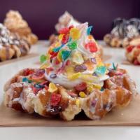 Fruity Pebble Waffle · Our delicious Belgian Pearl Sugar waffle, dusted with powdered sugar, fruity pebbles, our ho...