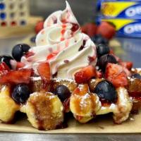 Very Berry Waffle · Our delicious Belgian Pearl Sugar waffle, dusted with powdered sugar, topped with fresh cut ...